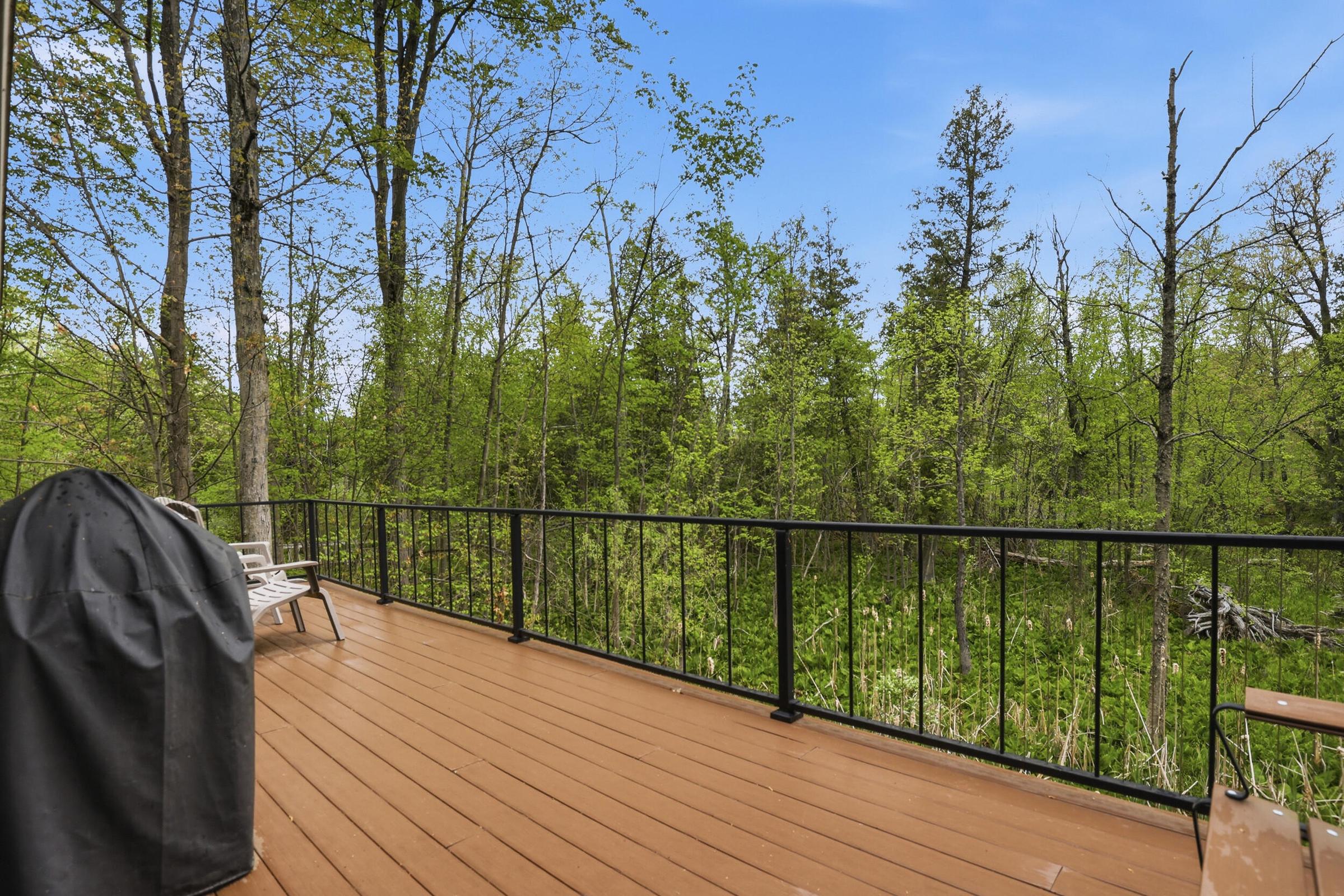 Tucked away on over an acre along the Little Muskegon River in the hea – image 44