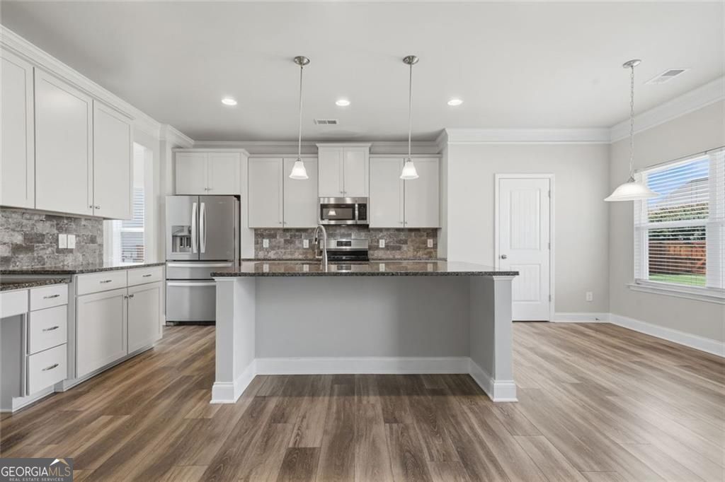 Flawlessly maintained and thoughtfully designed, this home exudes the – image 19