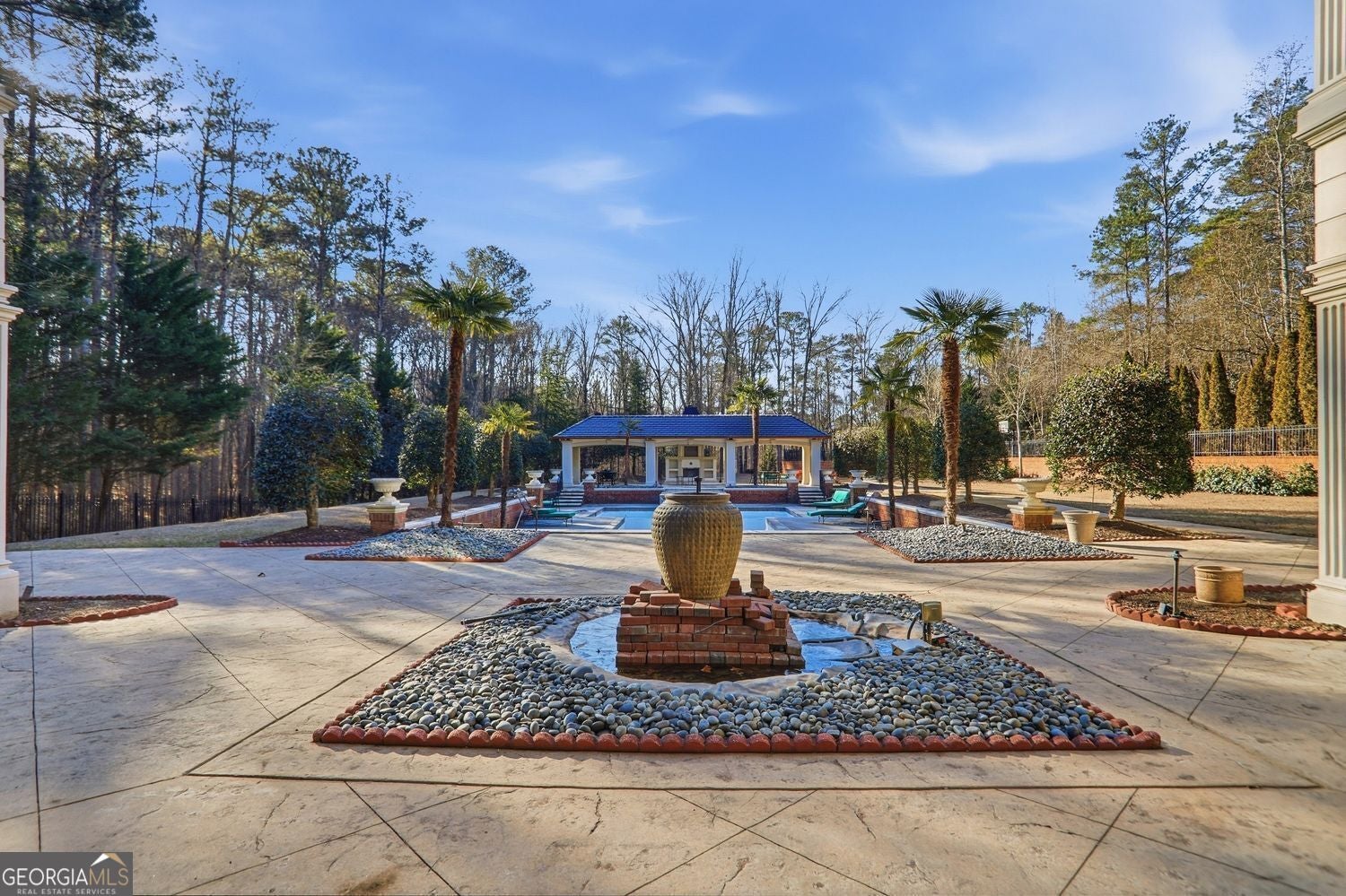 Set on 3.8 beautifully manicured acres, this elegant gated estate offe – image 137