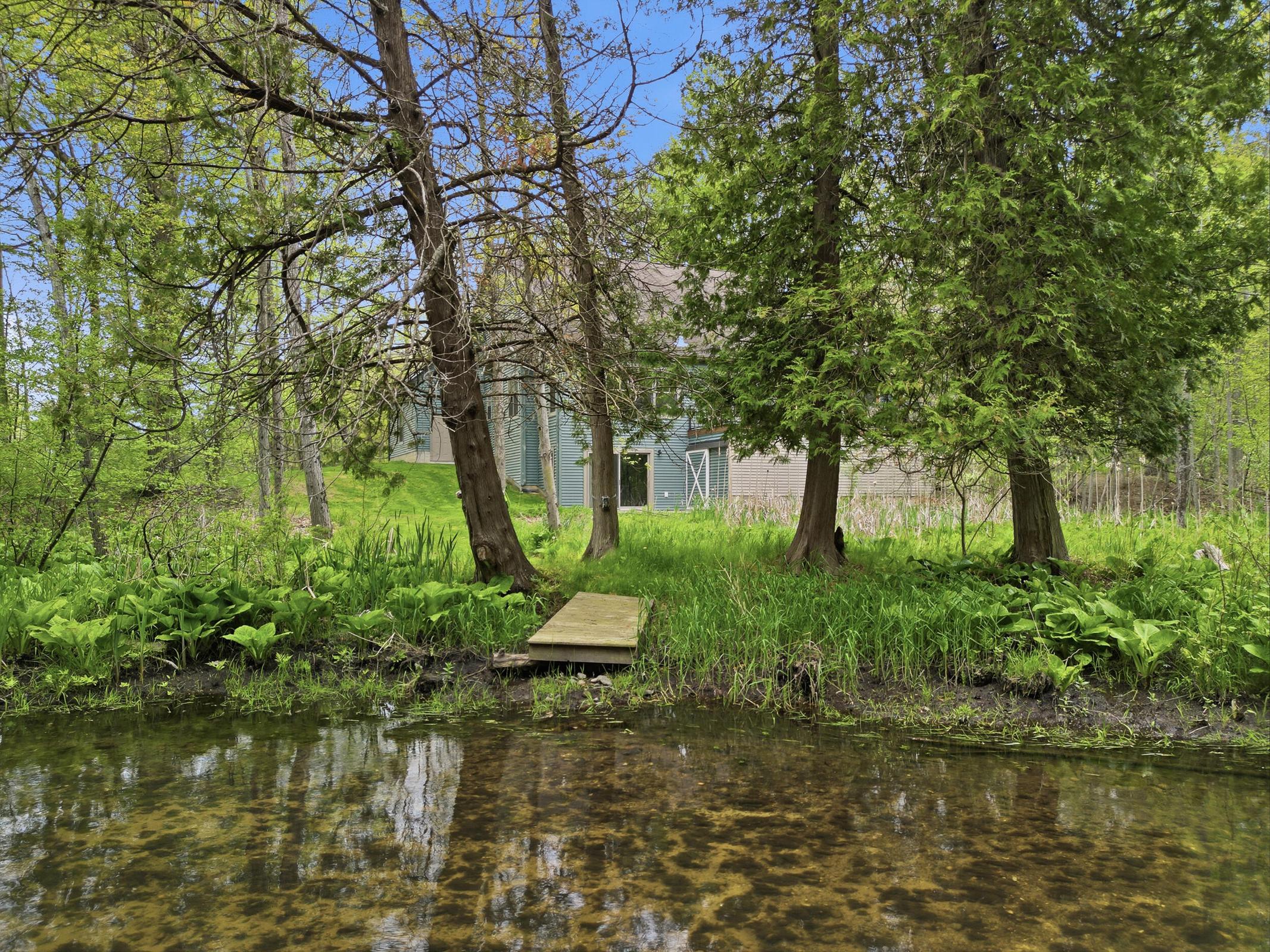 Tucked away on over an acre along the Little Muskegon River in the hea – image 6