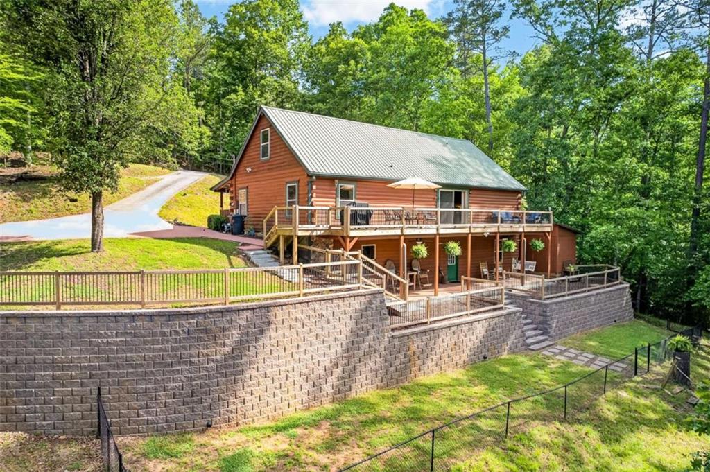 Fully furnished true log home on 5.78 private wooded acres in sought-a – image 1