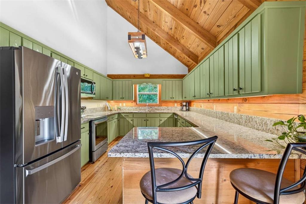 Fully furnished true log home on 5.78 private wooded acres in sought-a – image 7