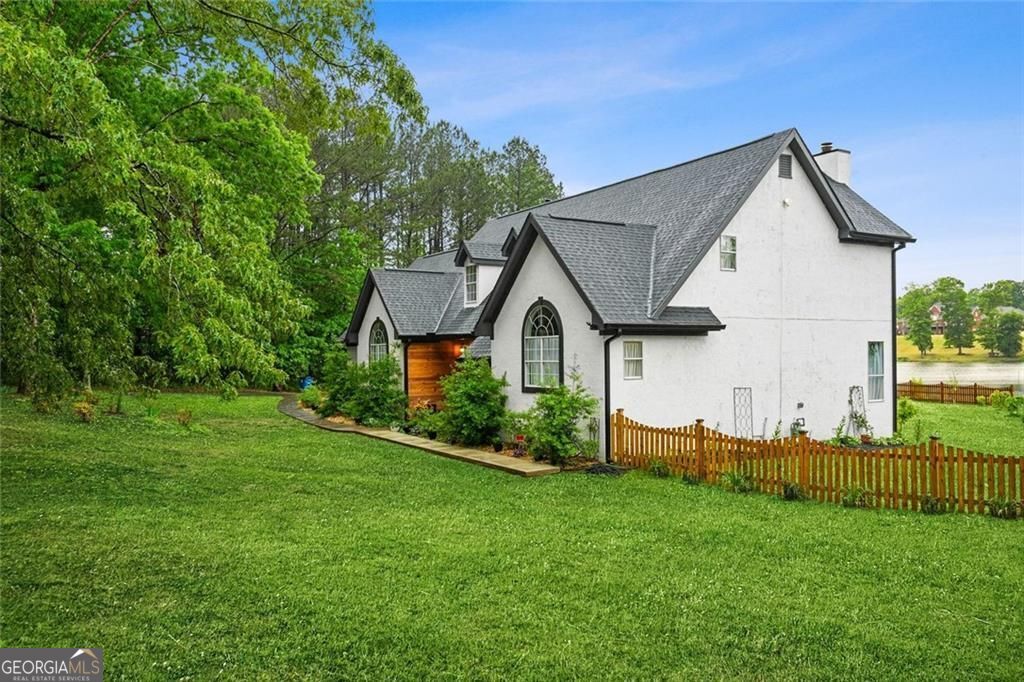 Welcome to 1229 Park Place Drive, a beautifully updated waterfront res – image 3