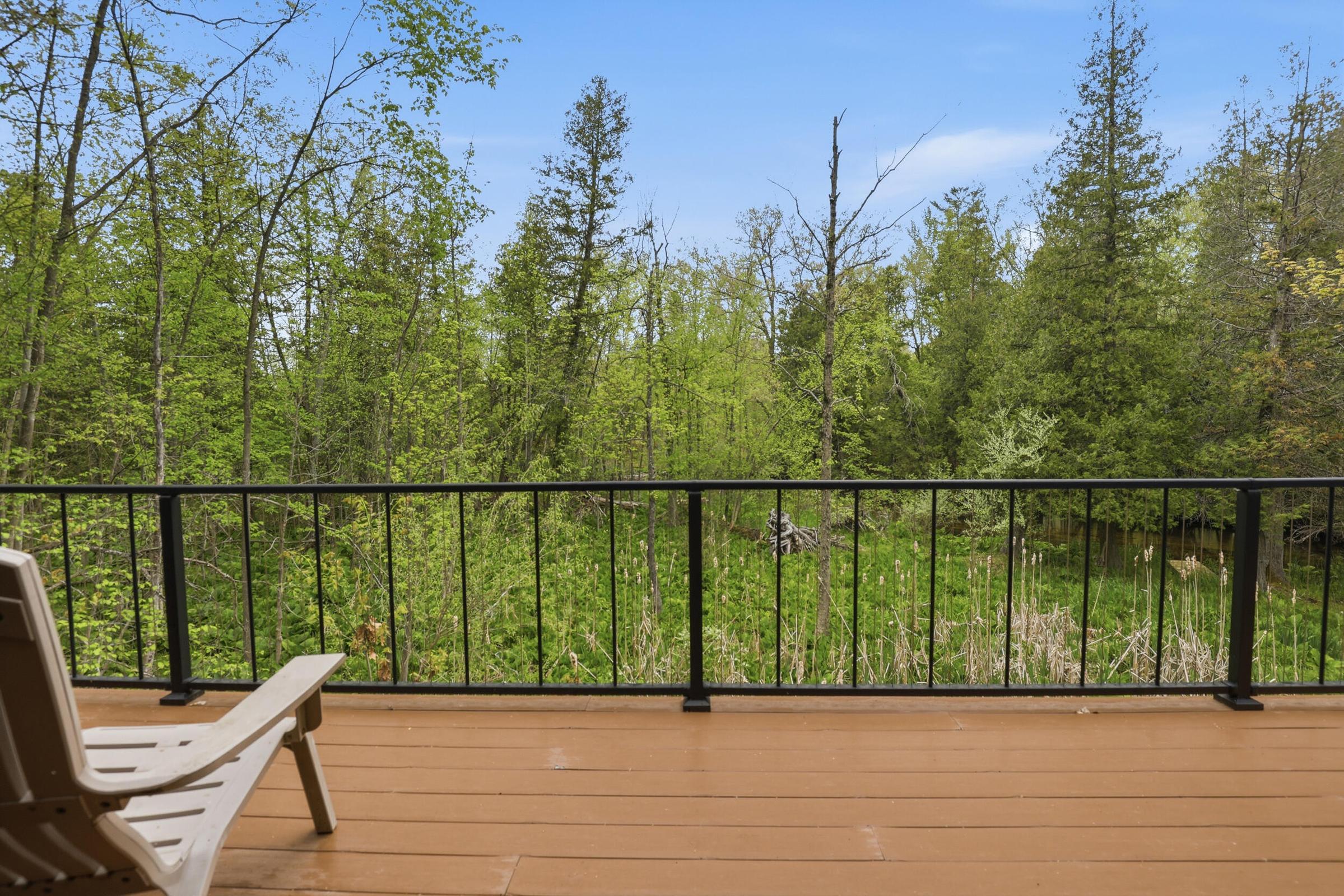 Tucked away on over an acre along the Little Muskegon River in the hea – image 45