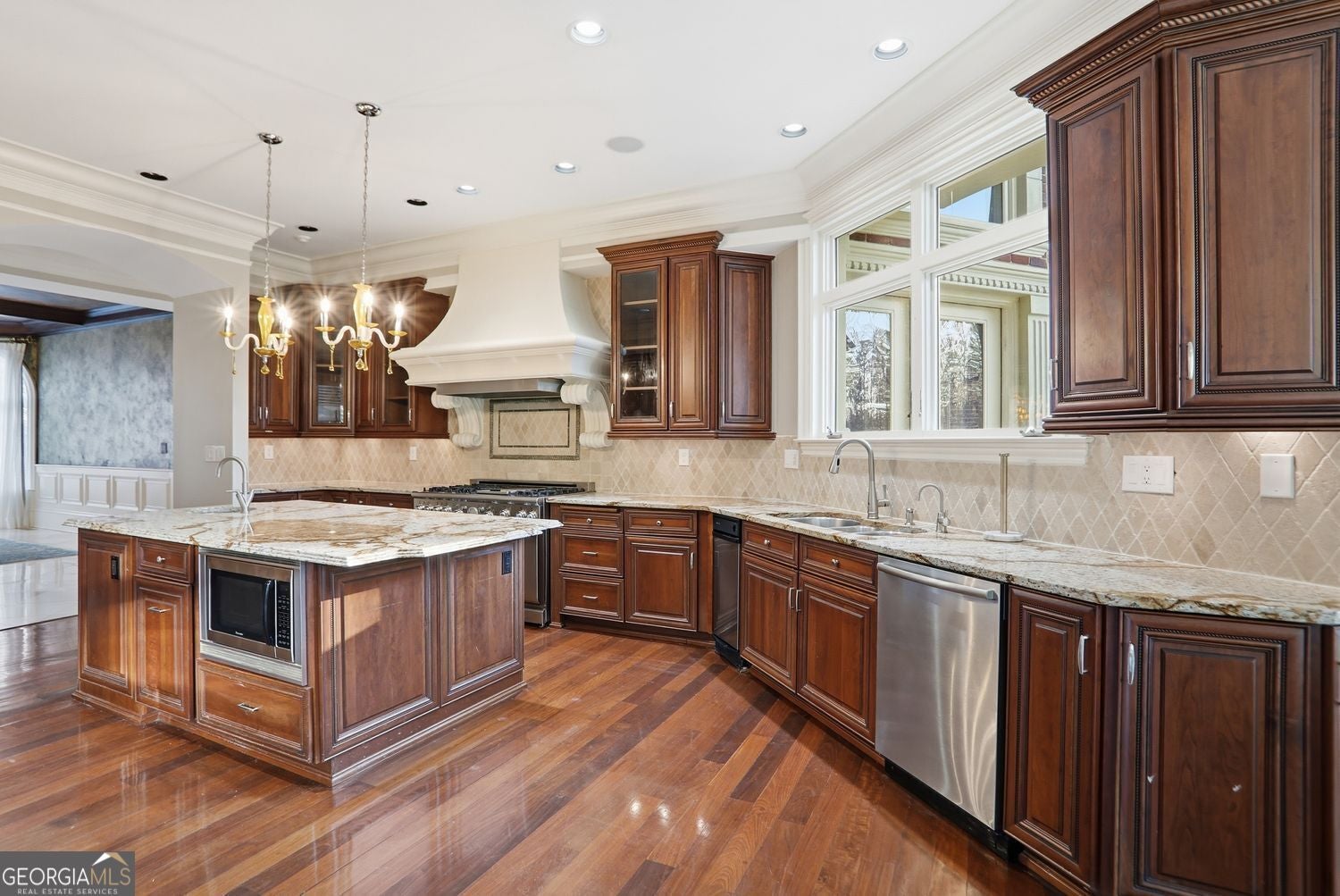 Set on 3.8 beautifully manicured acres, this elegant gated estate offe – image 88