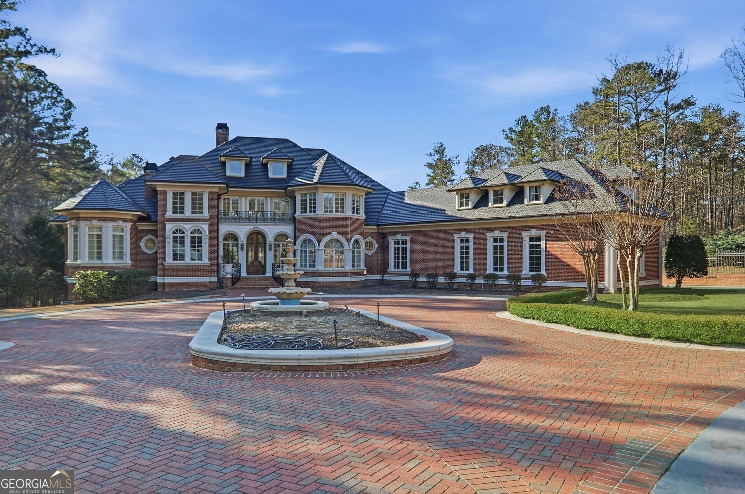 Set on 3.8 beautifully manicured acres, this elegant gated estate offe – image 76