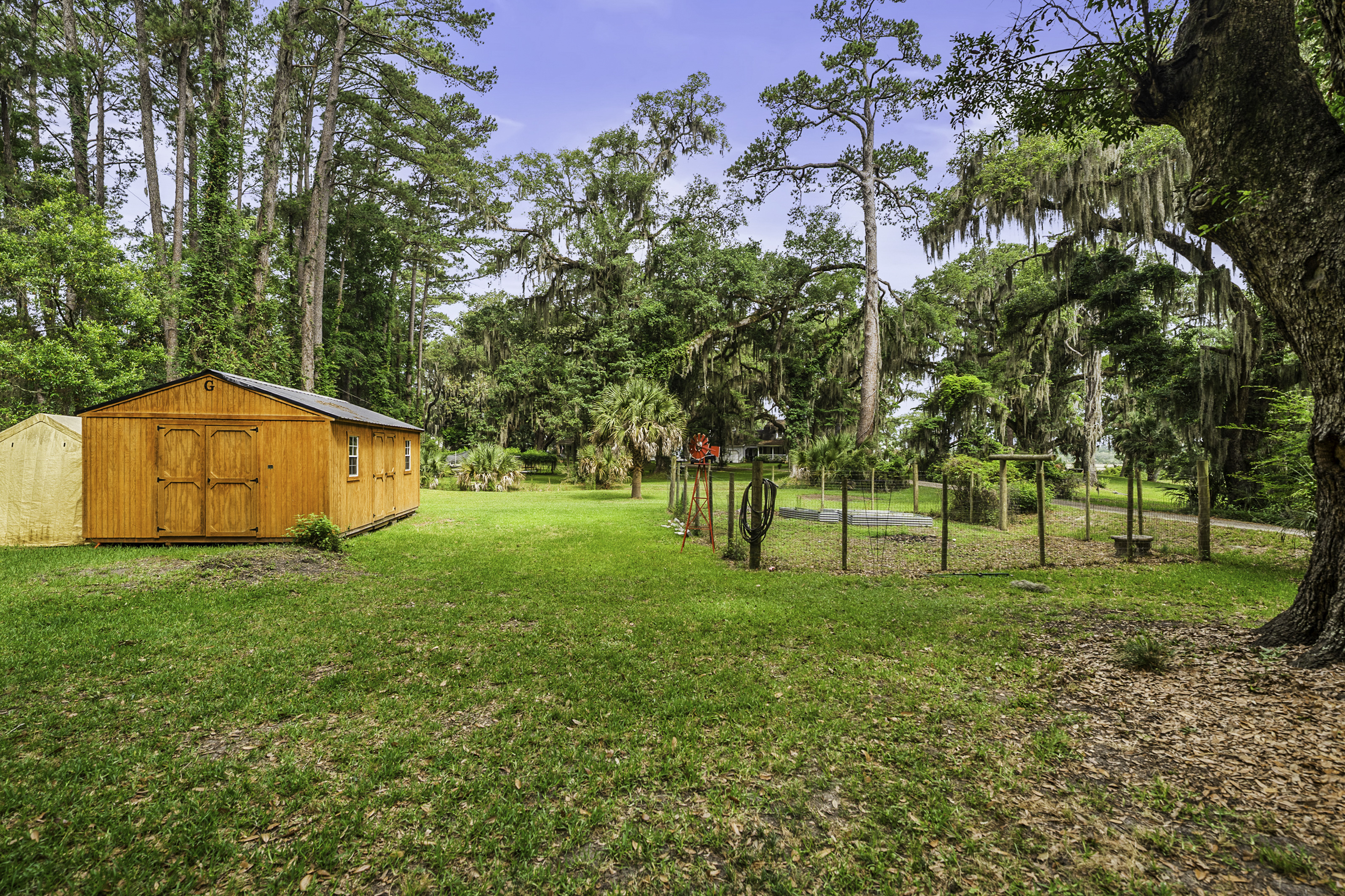 One of a kind, Lowcountry Living! This beautiful house sitting amongst – image 64