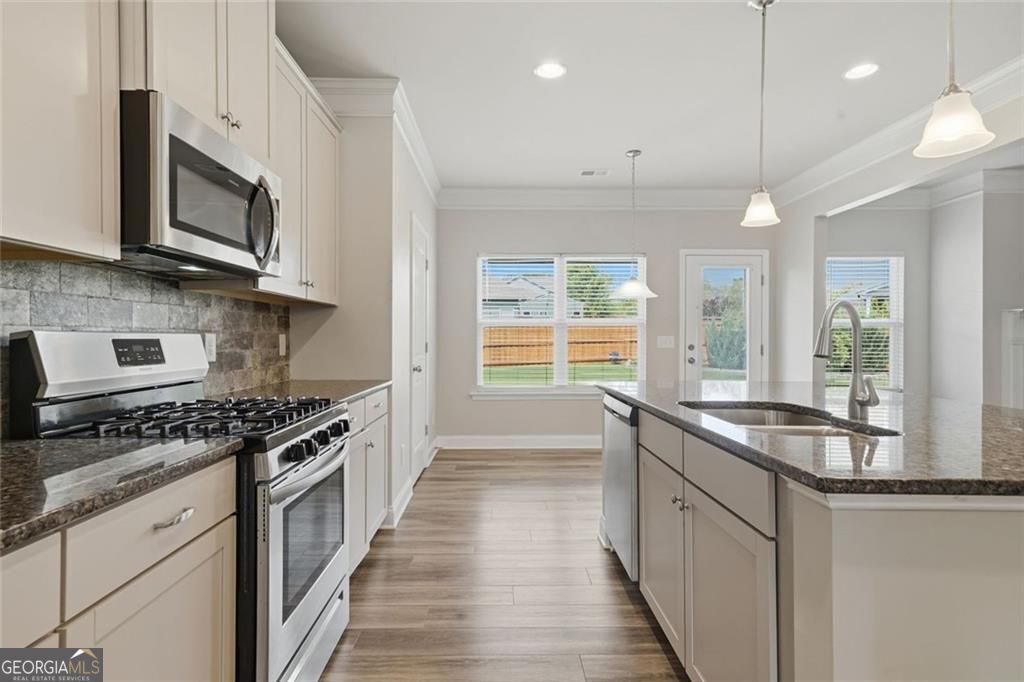 Flawlessly maintained and thoughtfully designed, this home exudes the – image 21