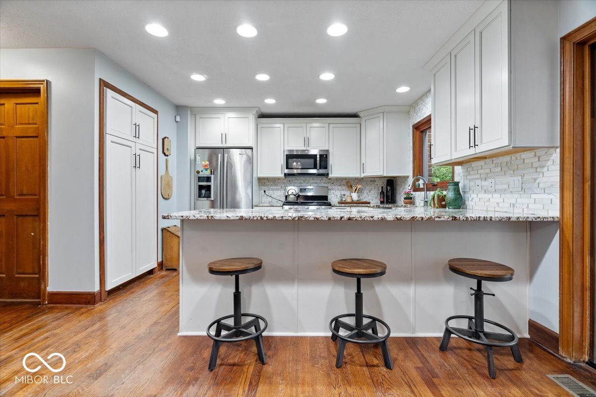 Updates galore in desirable Feather Cove III! Nestled on a half-acre w – image 13
