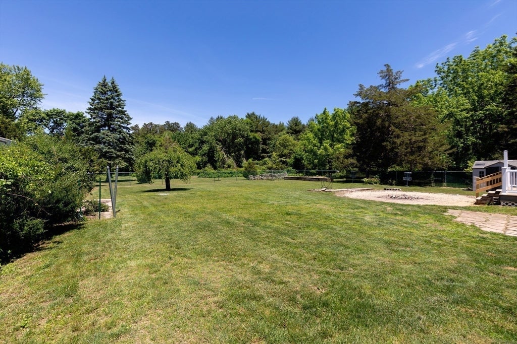 Nestled on over 2 acres, this Classic New England Cape offers the perf – image 31
