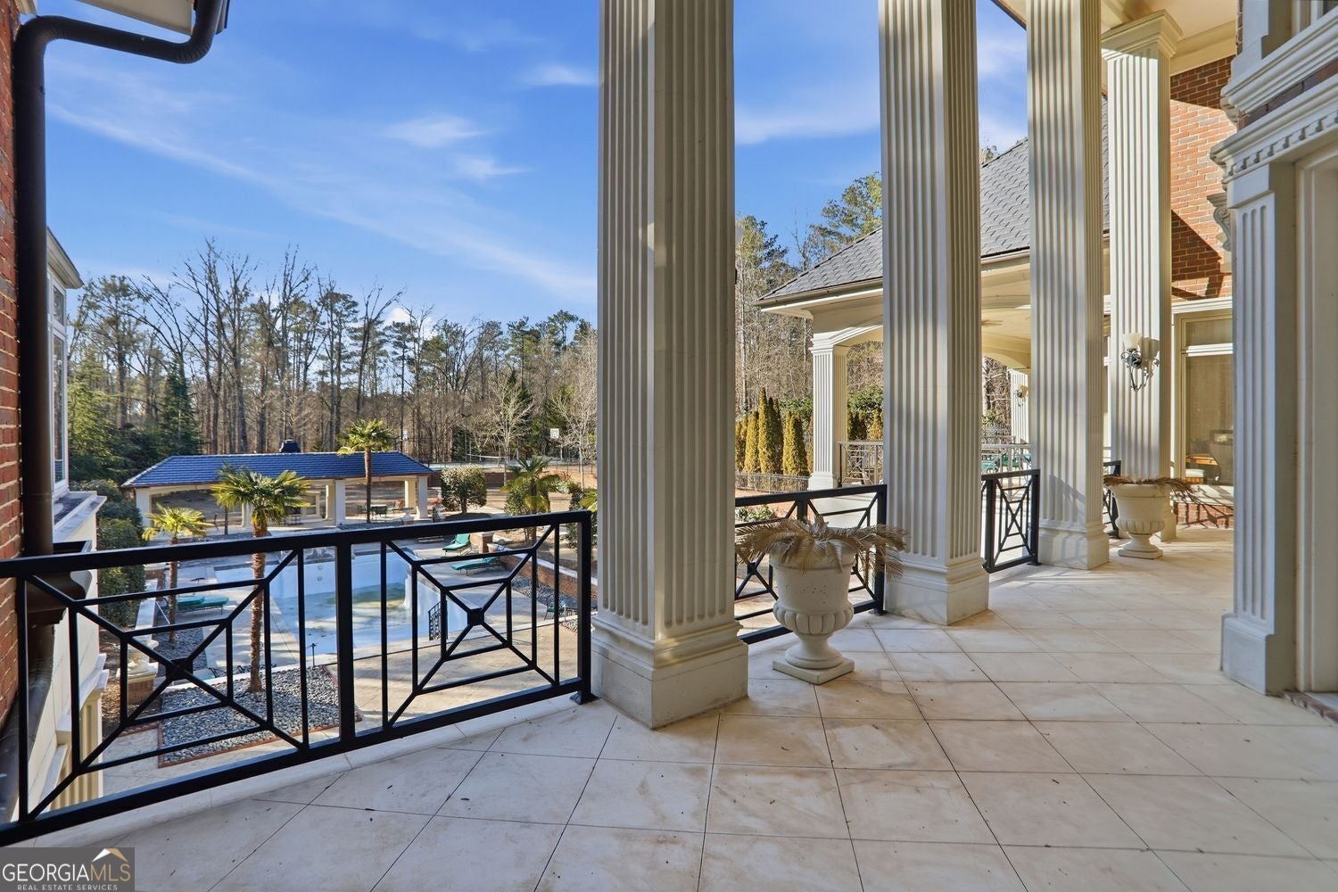 Set on 3.8 beautifully manicured acres, this elegant gated estate offe – image 148