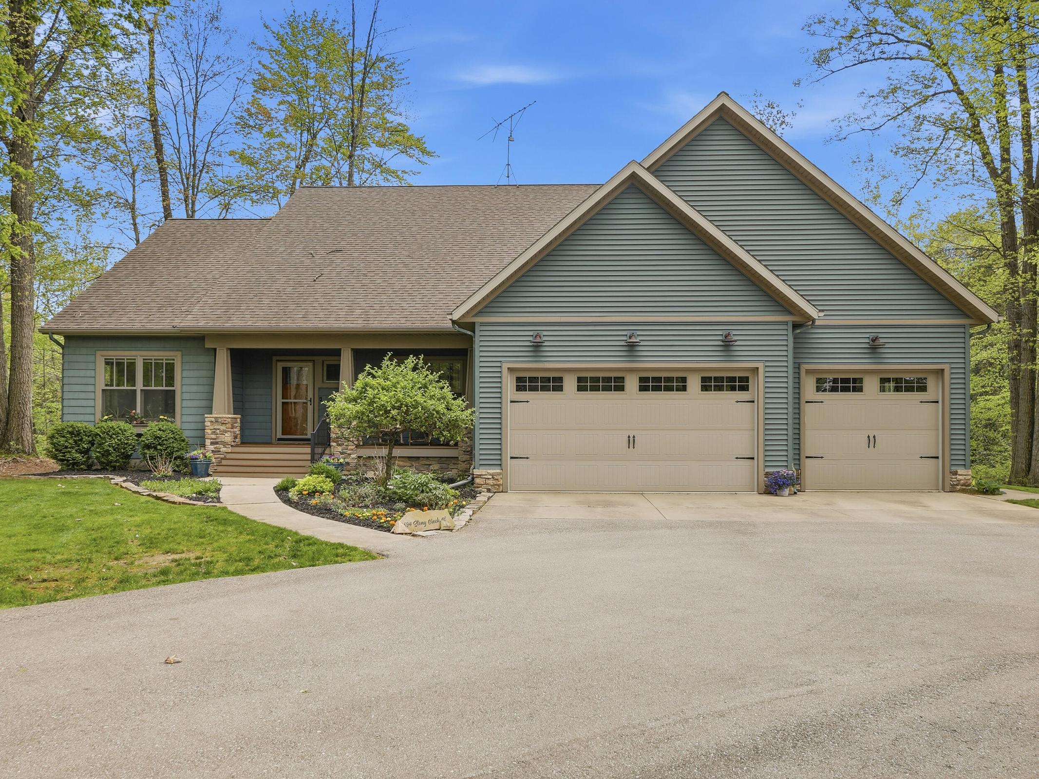 Tucked away on over an acre along the Little Muskegon River in the hea – image 52