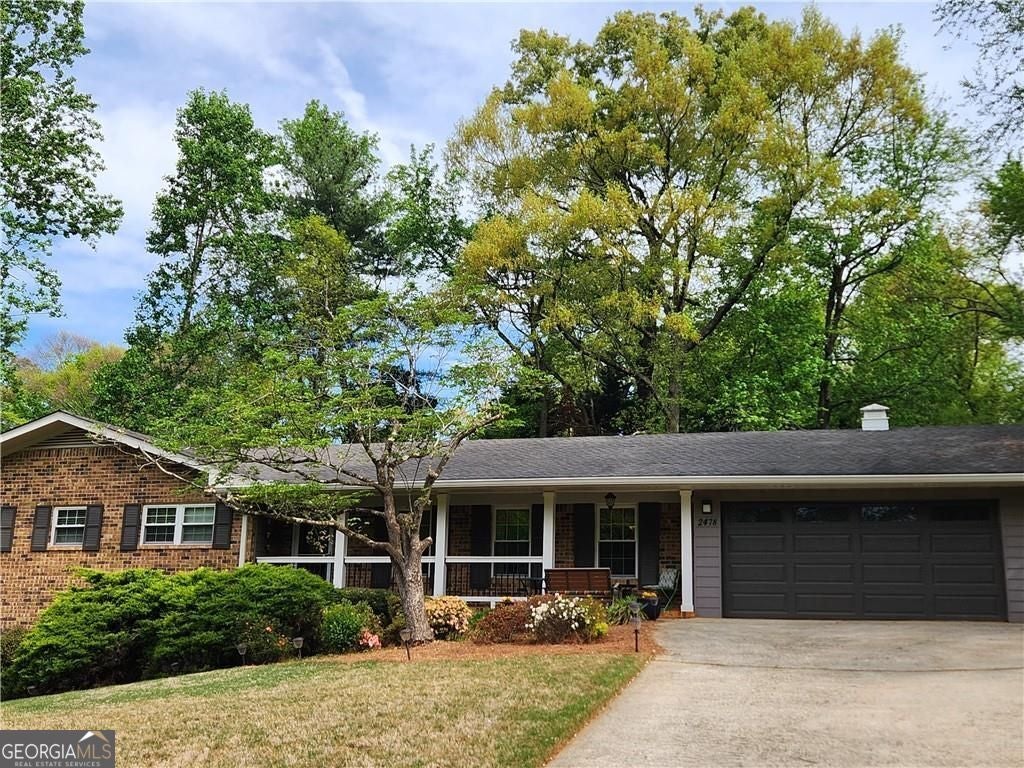 Beautifully updated and ideally located in the heart of Dunwoody, this – image 2