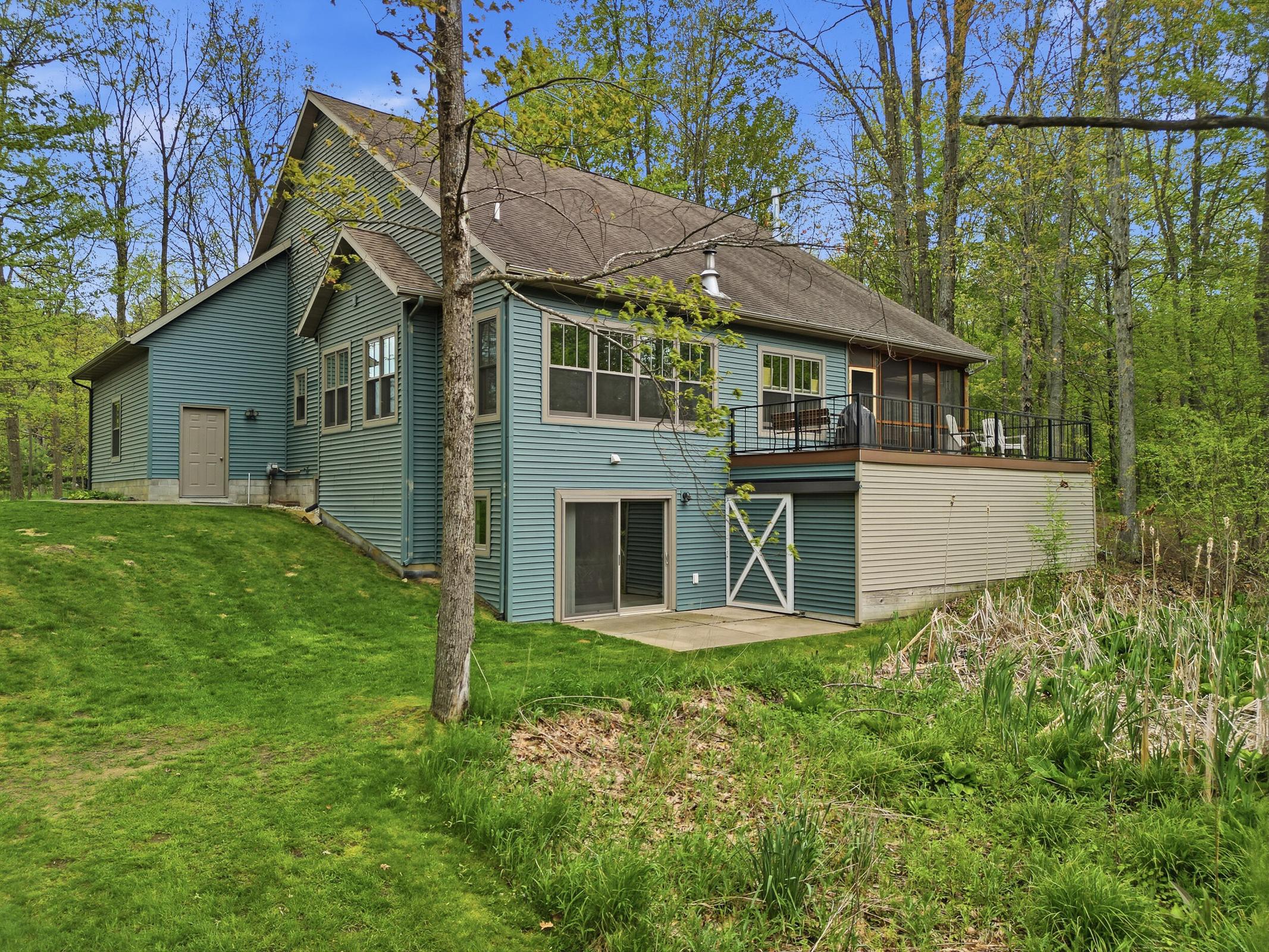 Tucked away on over an acre along the Little Muskegon River in the hea – image 47