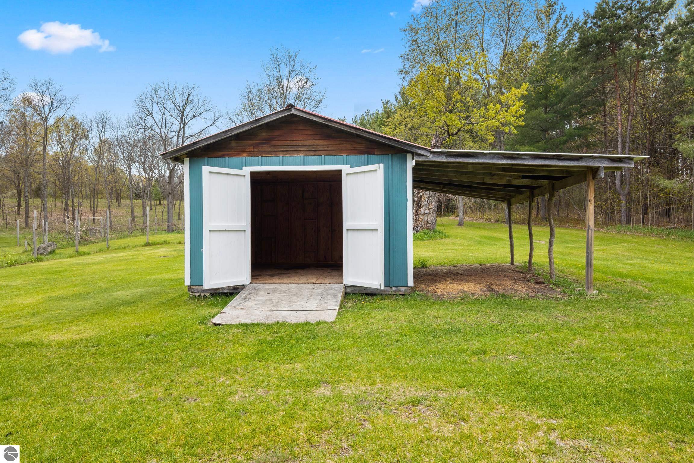 This 3-bedroom, 2.5-bath farmhouse offers a property designed for coun – image 62
