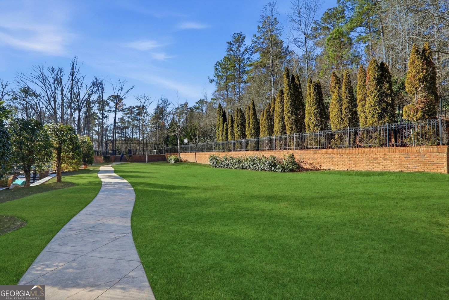 Set on 3.8 beautifully manicured acres, this elegant gated estate offe – image 139
