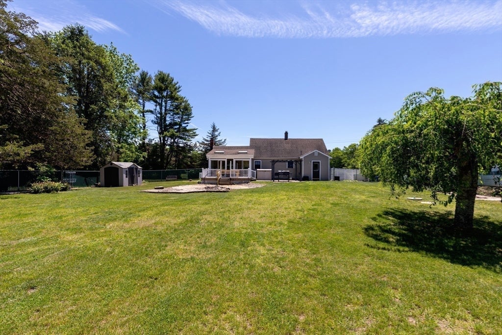 Nestled on over 2 acres, this Classic New England Cape offers the perf – image 30