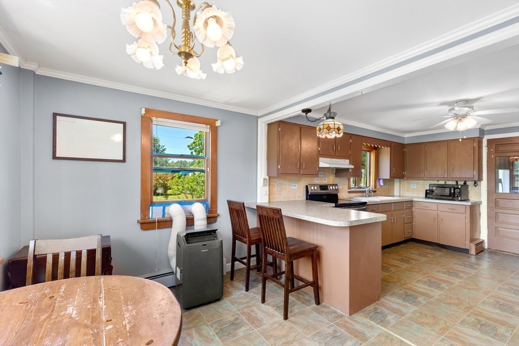 Nestled on over 2 acres, this Classic New England Cape offers the perf – image 12