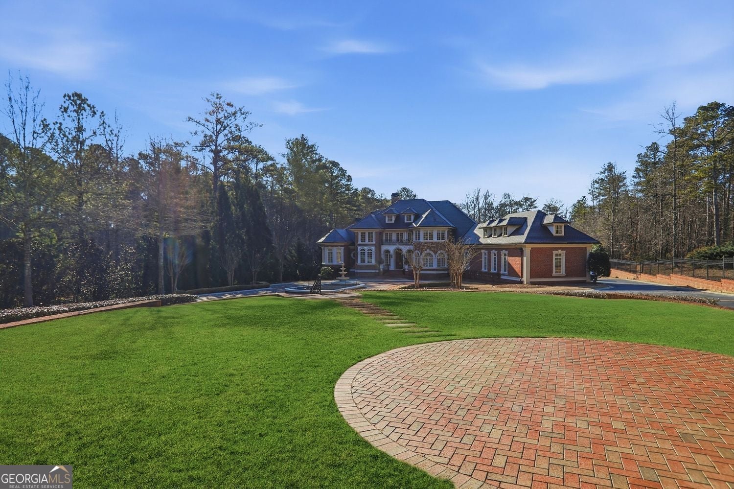Set on 3.8 beautifully manicured acres, this elegant gated estate offe – image 143