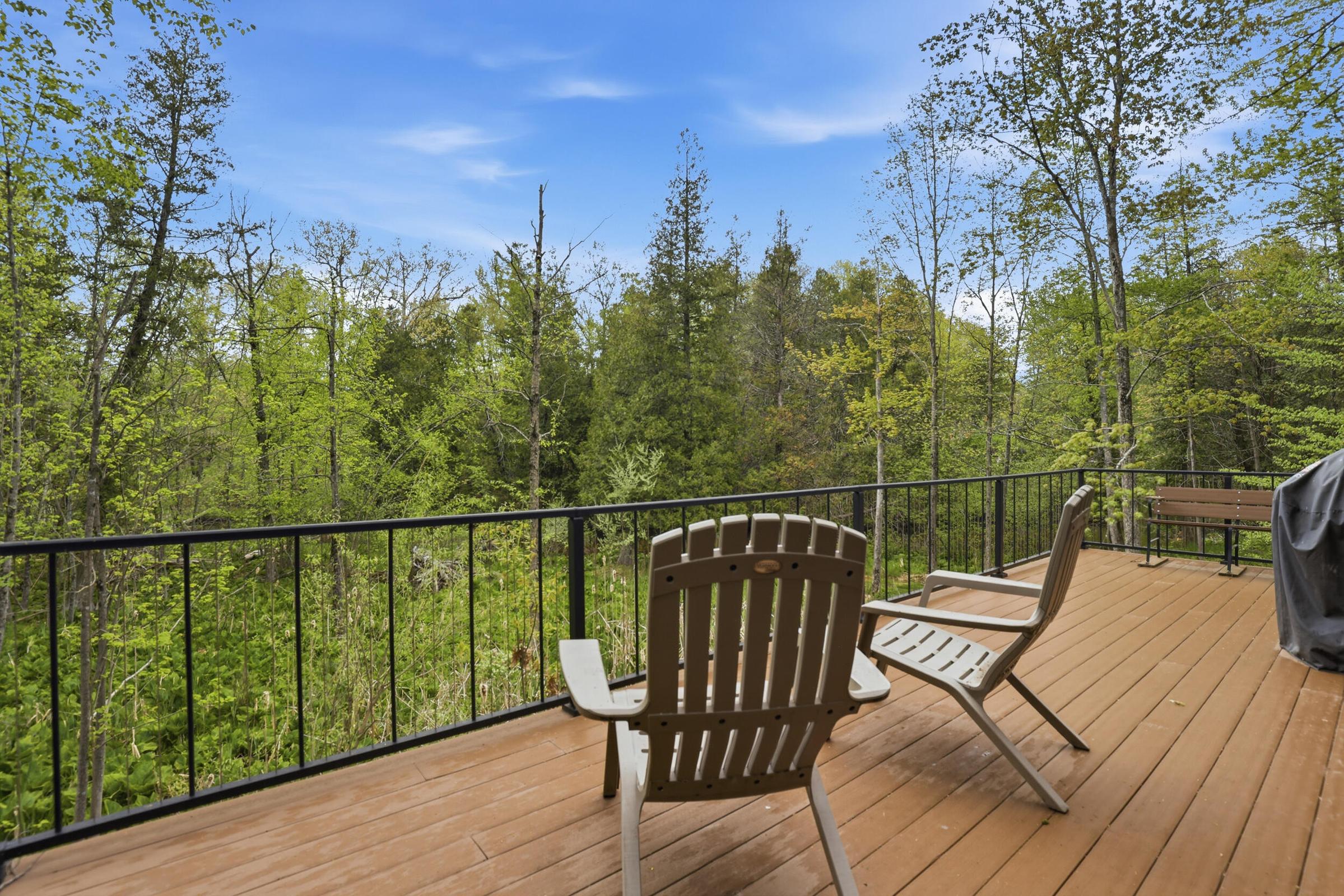 Tucked away on over an acre along the Little Muskegon River in the hea – image 43