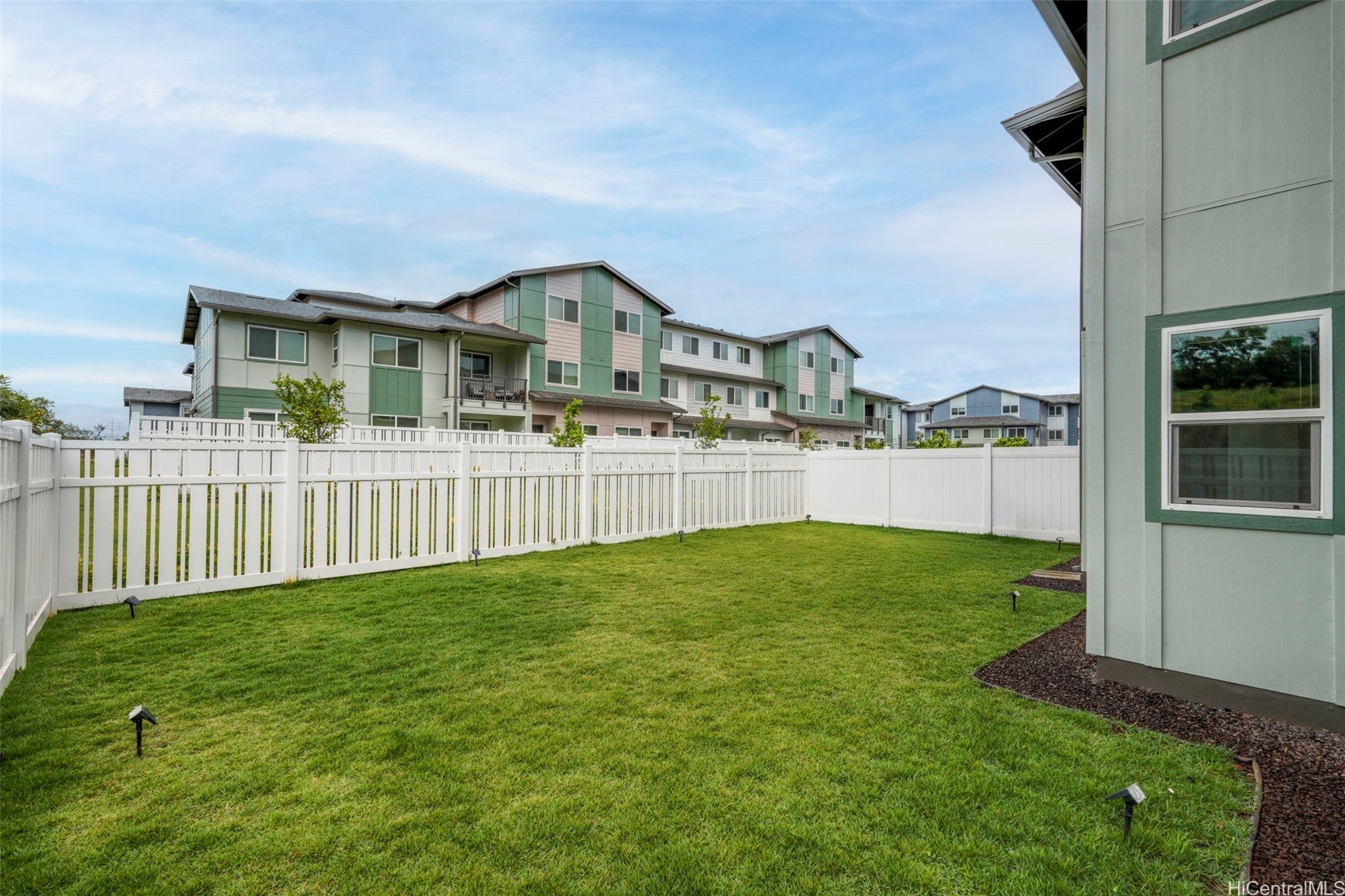 Welcome home to this beautifully maintained corner townhome at Kapili – image 1