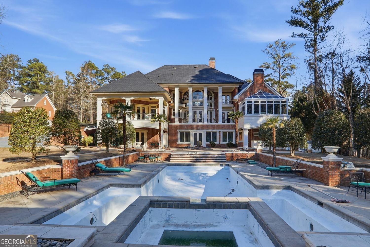 Set on 3.8 beautifully manicured acres, this elegant gated estate offe – image 140