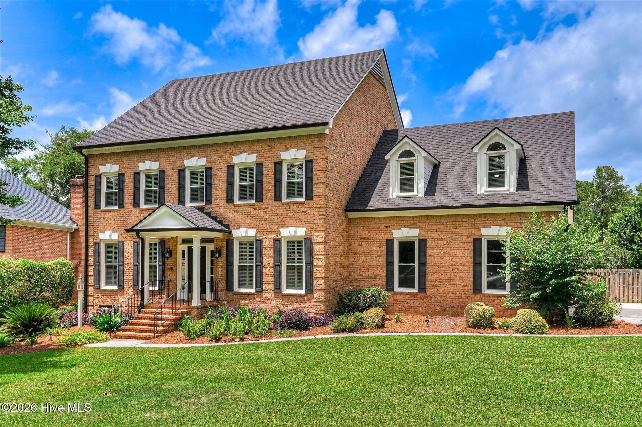Welcome to this stunning brick home nestled on a quiet cul-de-sac in t – image 2