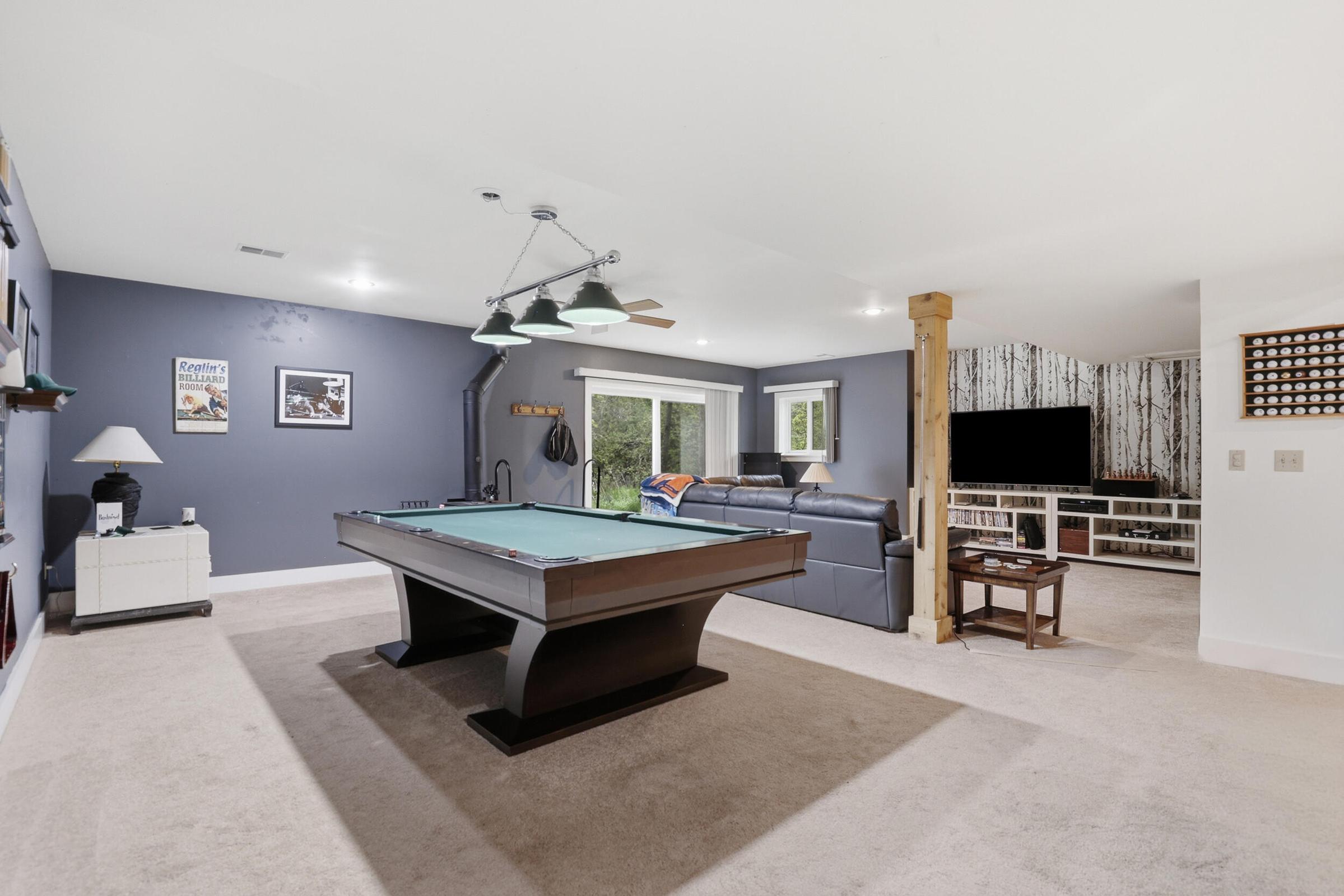 Tucked away on over an acre along the Little Muskegon River in the hea – image 34
