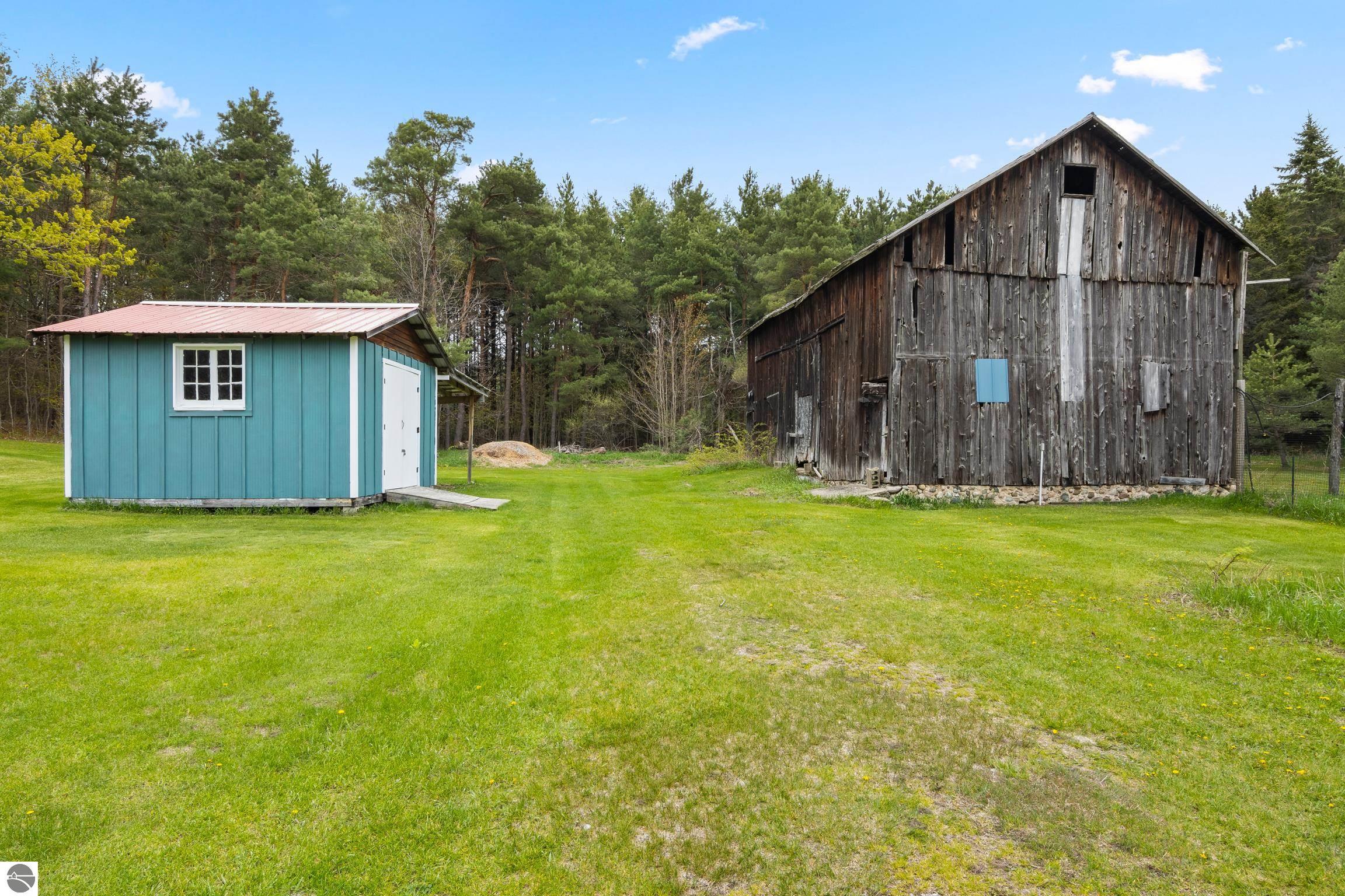 This 3-bedroom, 2.5-bath farmhouse offers a property designed for coun – image 61