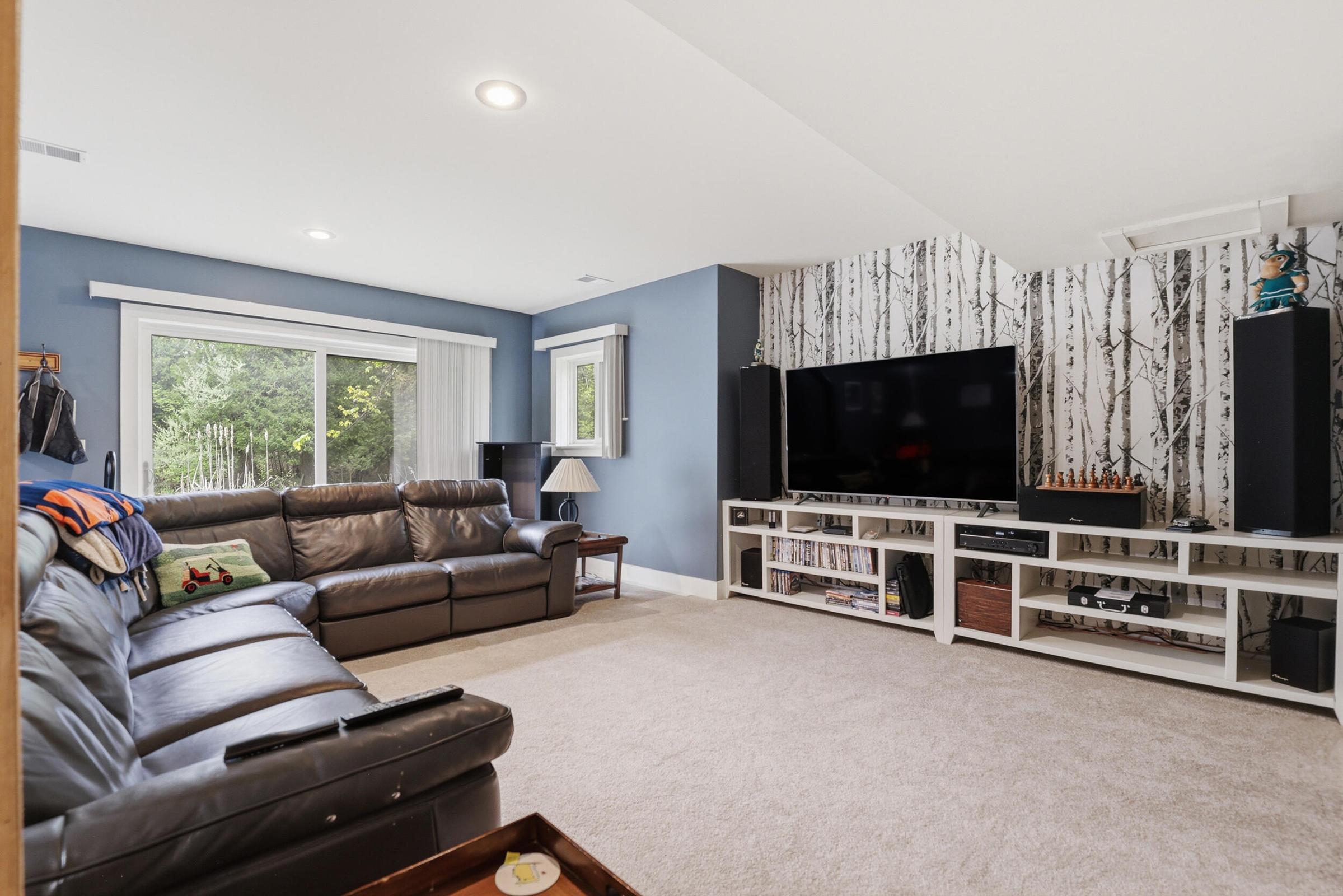 Tucked away on over an acre along the Little Muskegon River in the hea – image 36