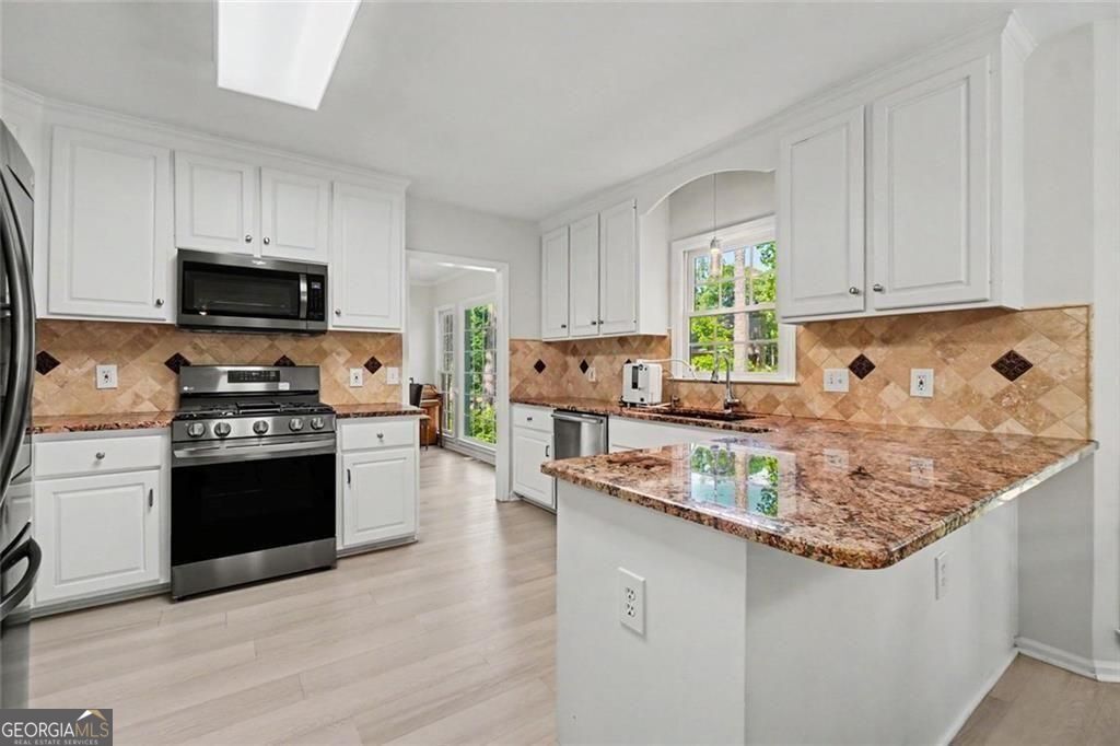 489 Broadstone Way in Brookstone III offers 7 bedrooms and 5 baths, in – image 2