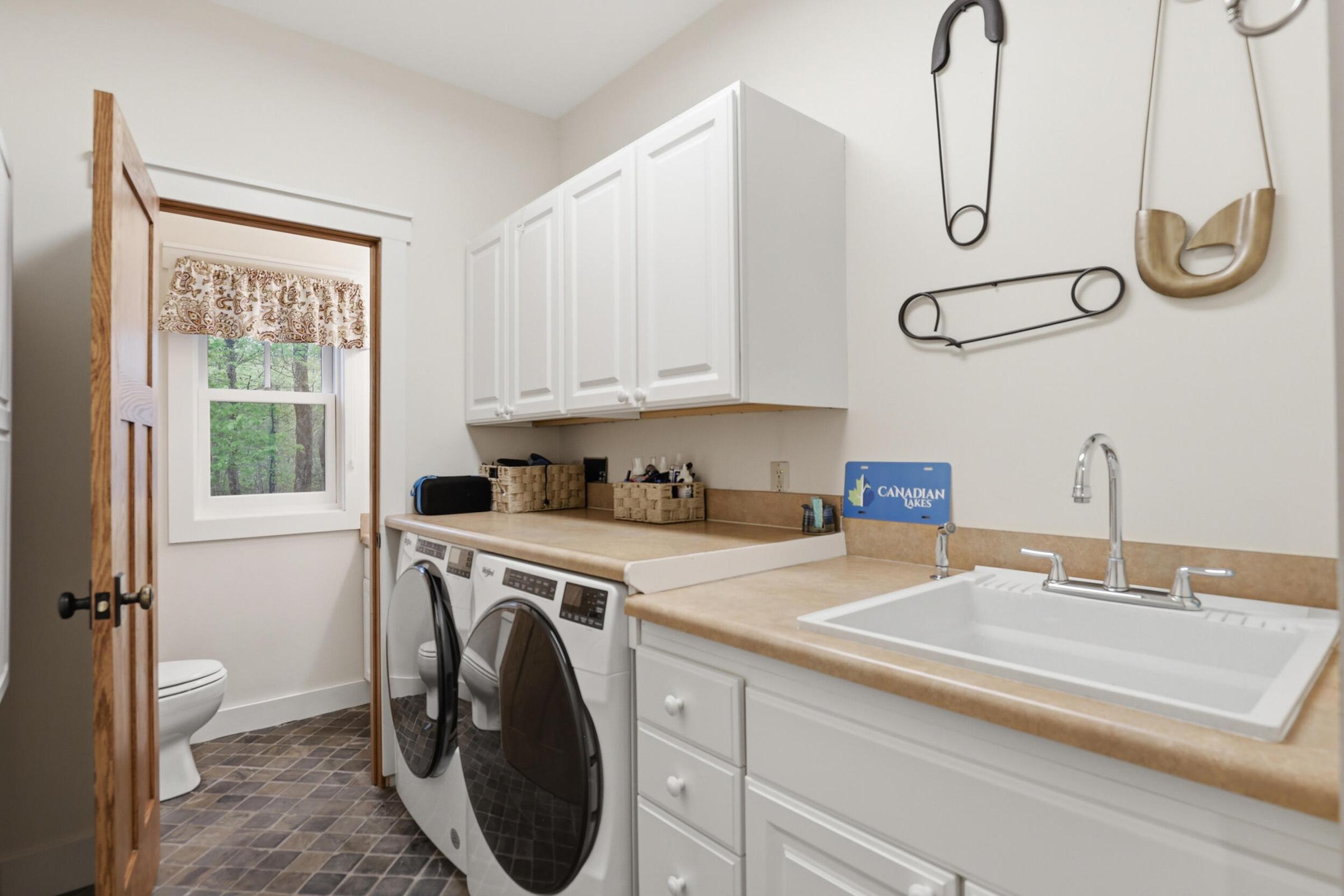 Tucked away on over an acre along the Little Muskegon River in the hea – image 33