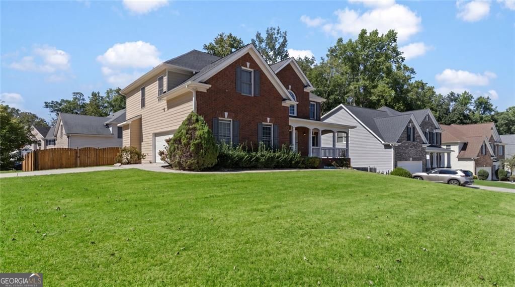 Just listed in the sought-after Arbors at Old Peachtree subdivision! T – image 2