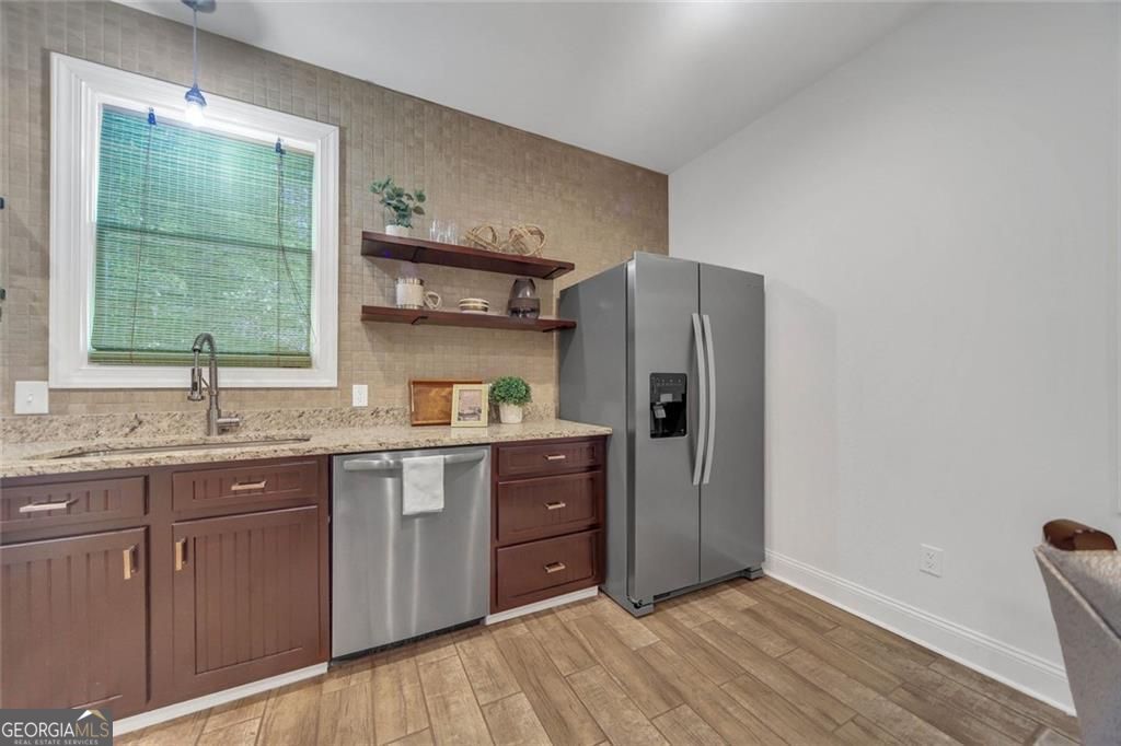 Freshly repositioned below $550K, this newer-construction Stone Mounta – image 7