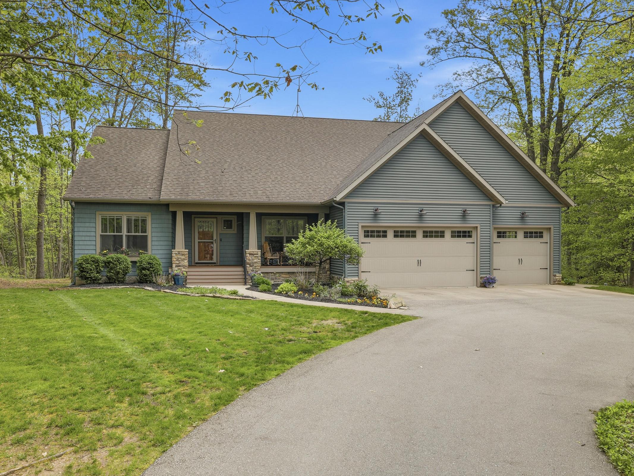 Tucked away on over an acre along the Little Muskegon River in the hea – image 4