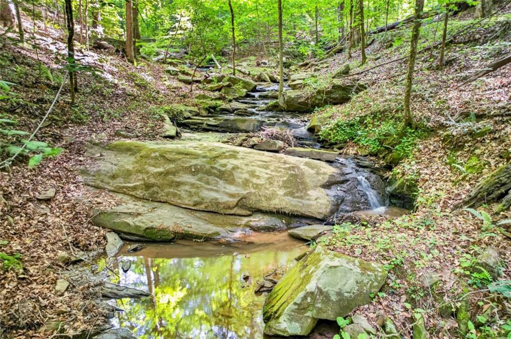 Fully furnished true log home on 5.78 private wooded acres in sought-a – image 48