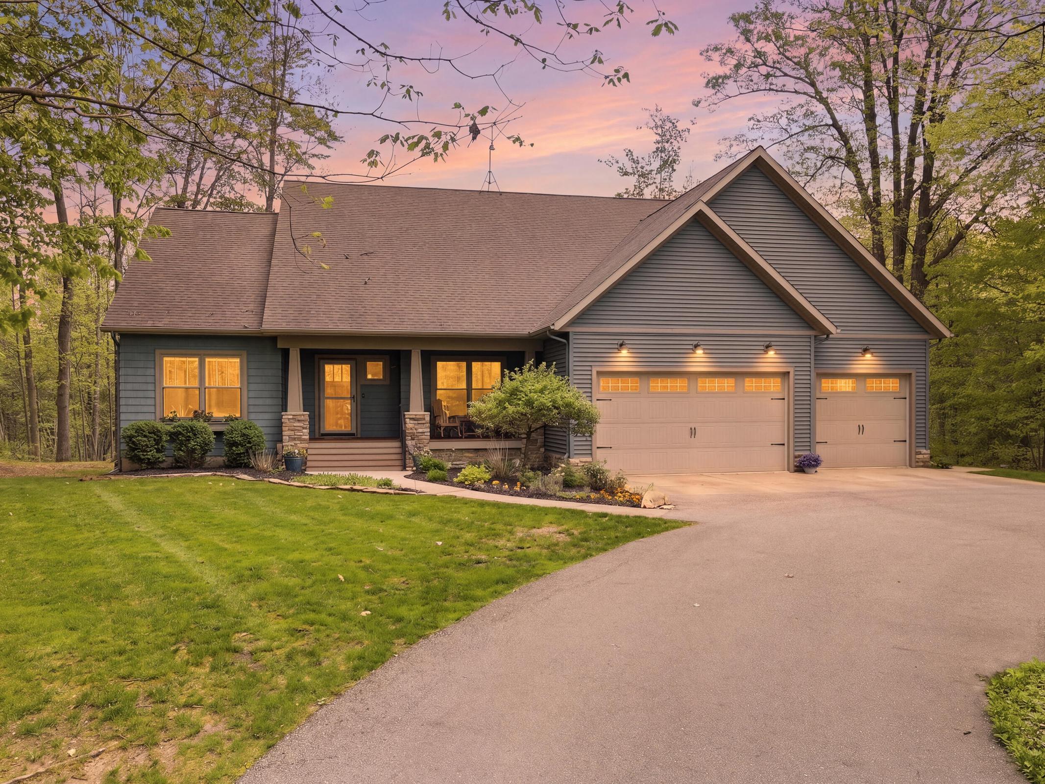 Tucked away on over an acre along the Little Muskegon River in the hea – image 1