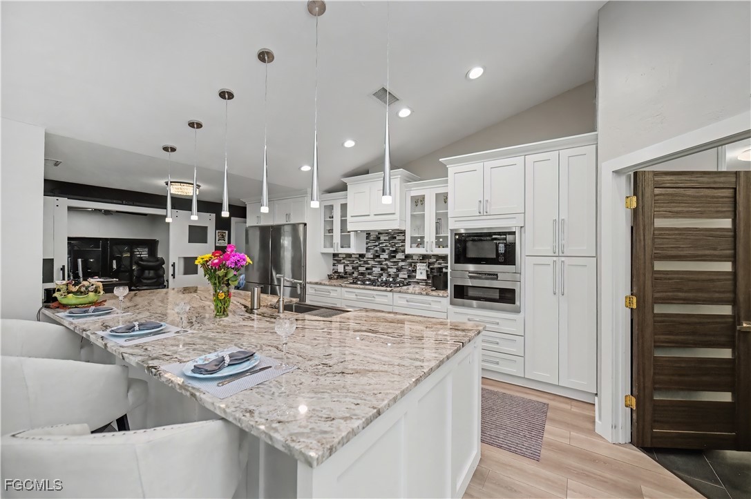 Welcome to your future GULF ACCESS HIDDEN GEM OF A home in the charmin – image 16