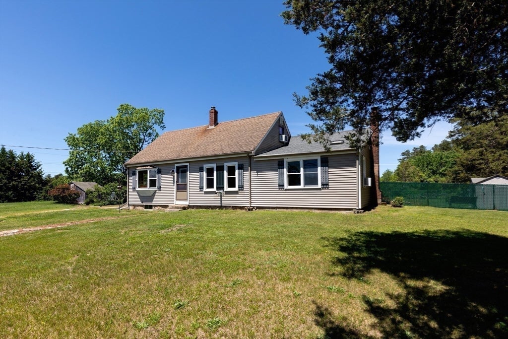 Nestled on over 2 acres, this Classic New England Cape offers the perf – image 29