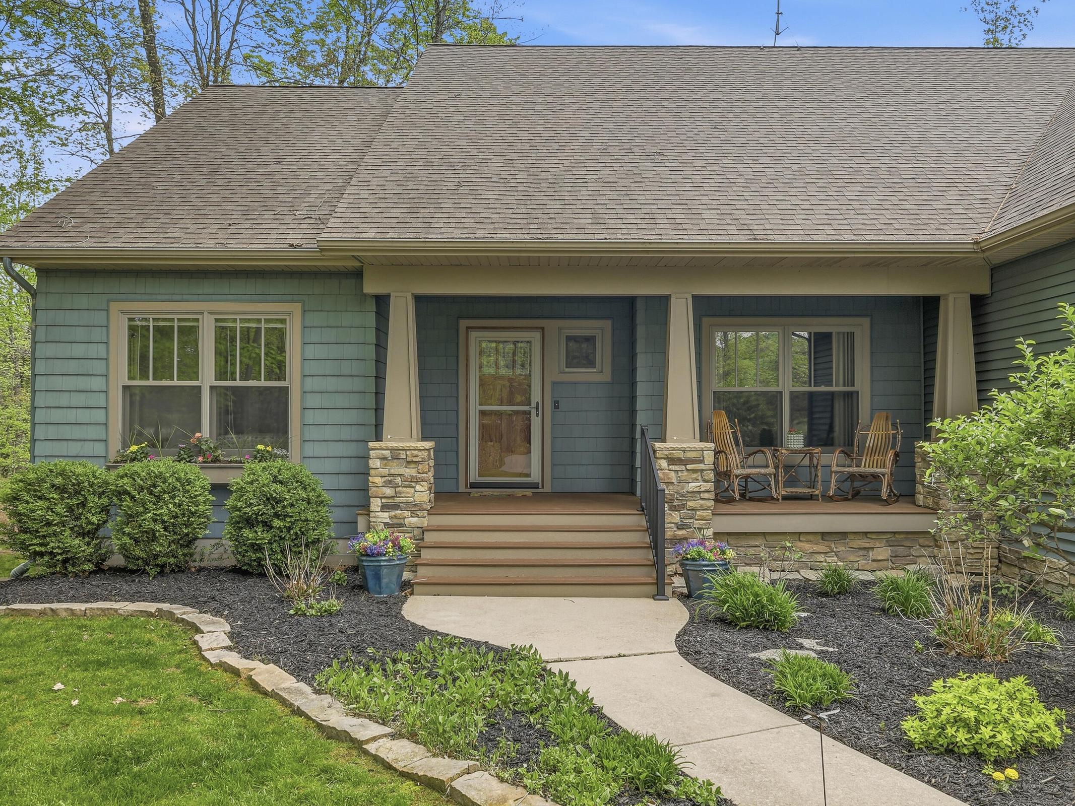 Tucked away on over an acre along the Little Muskegon River in the hea – image 3