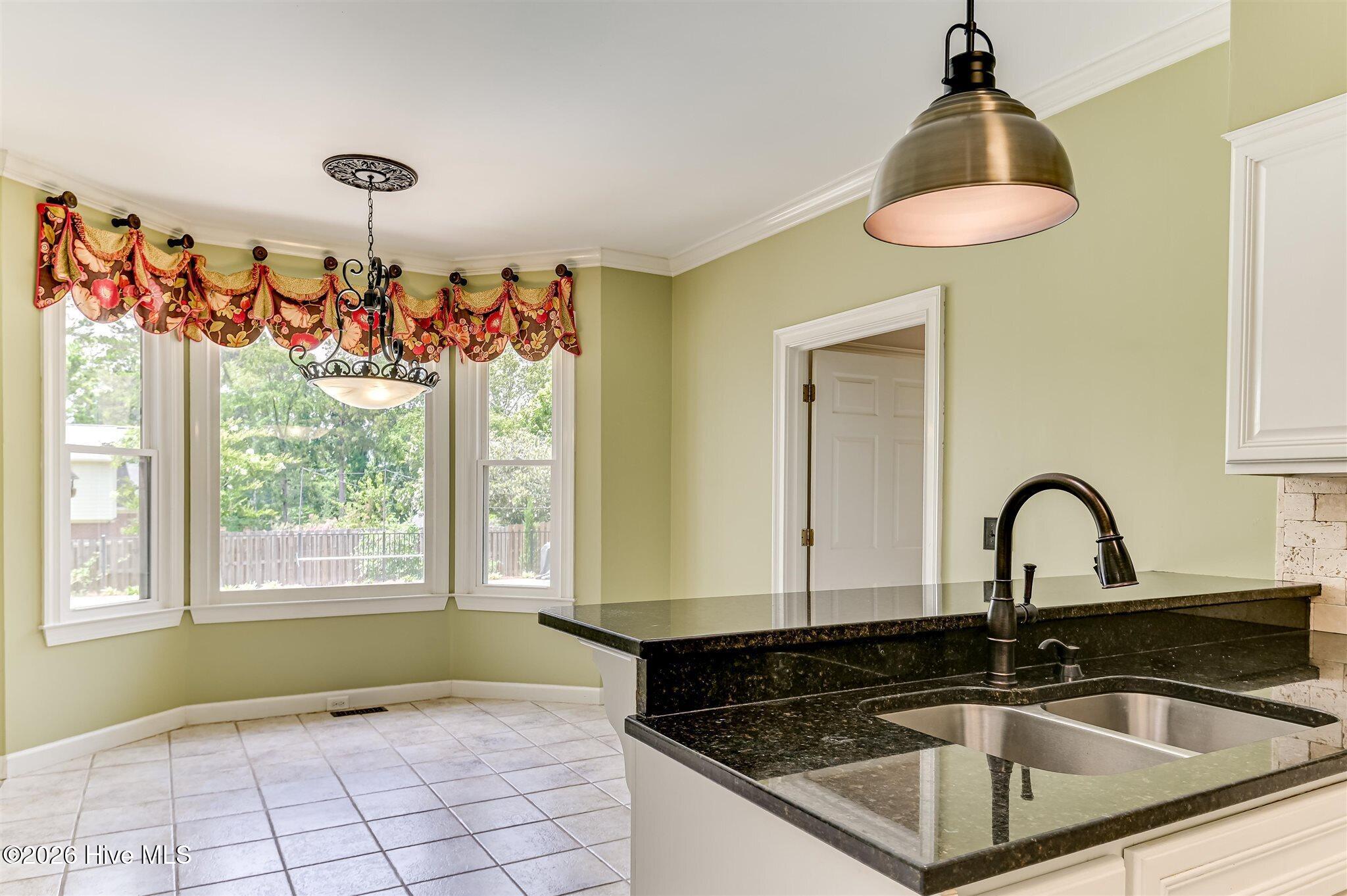 Welcome to this stunning brick home nestled on a quiet cul-de-sac in t – image 19