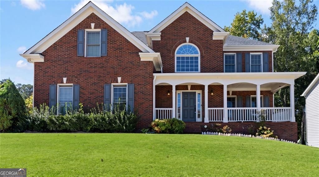 Just listed in the sought-after Arbors at Old Peachtree subdivision! T – image 1