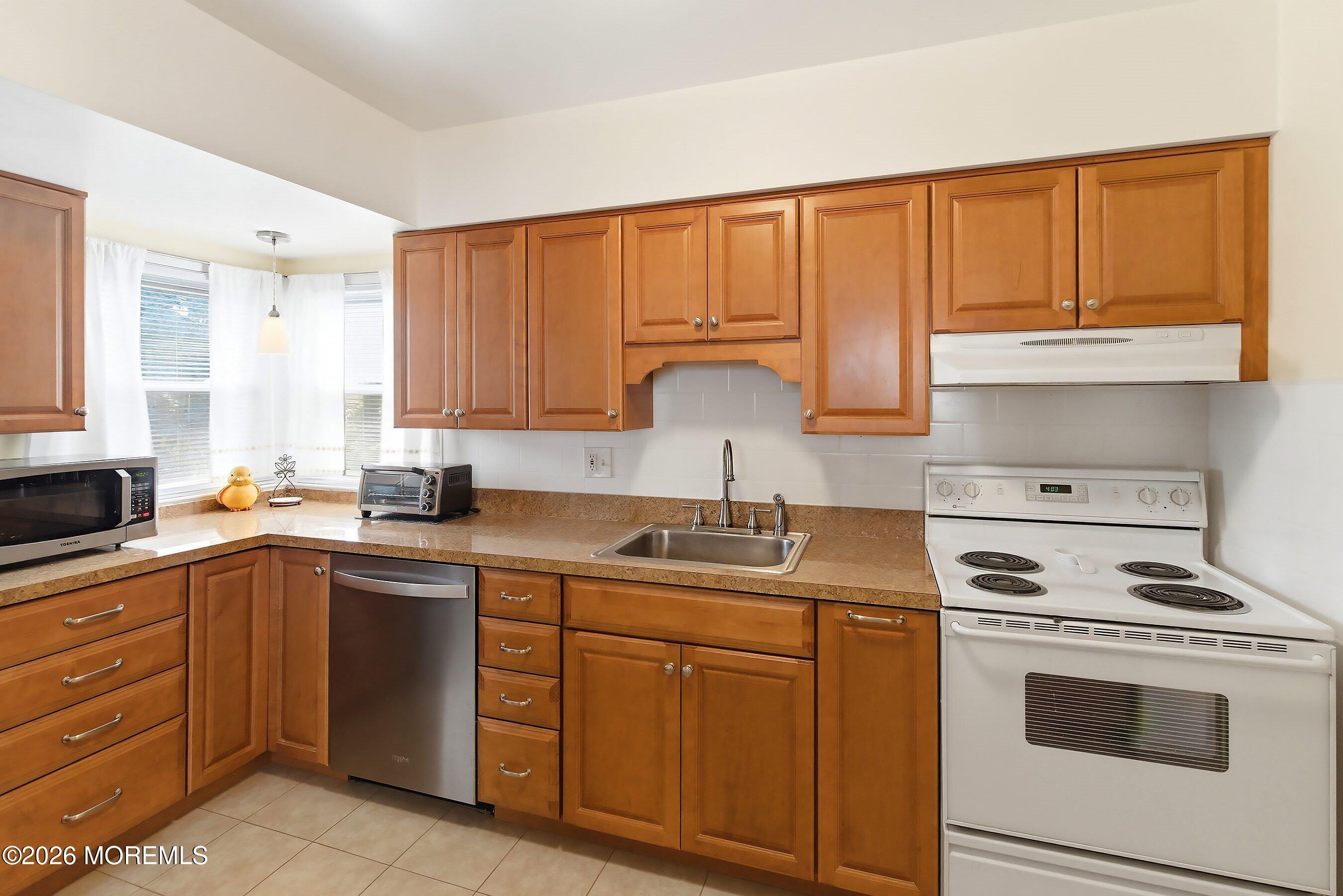 Pride of ownership shines throughout this 3-bedroom, 2-bath home, offe – image 7