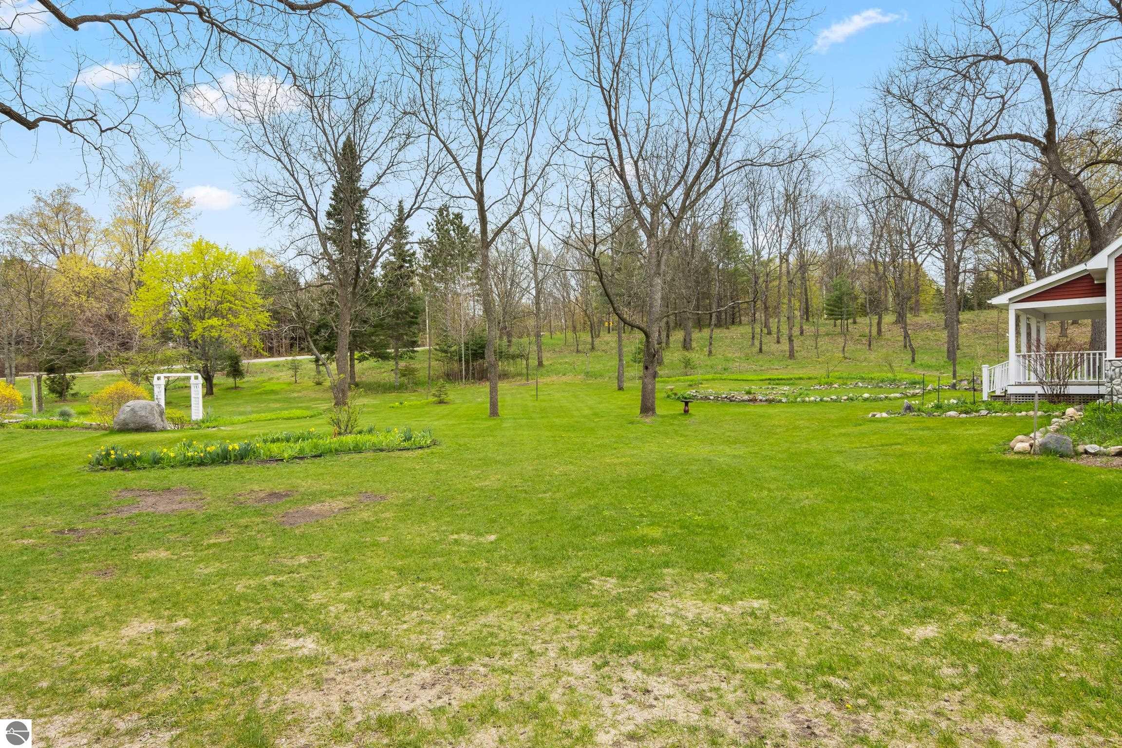 This 3-bedroom, 2.5-bath farmhouse offers a property designed for coun – image 55