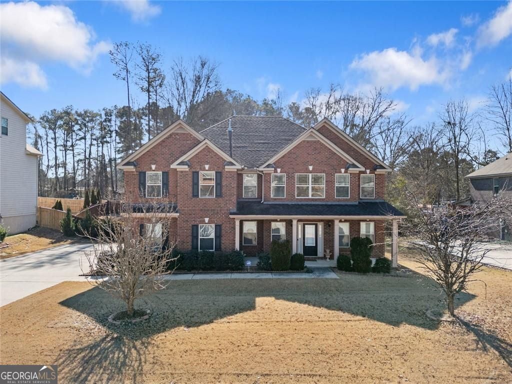 Timeless curb appeal and solid construction define this beautifully ma – image 1