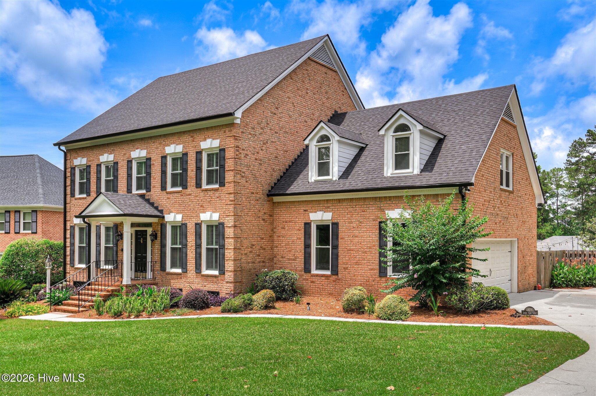 Welcome to this stunning brick home nestled on a quiet cul-de-sac in t – image 3