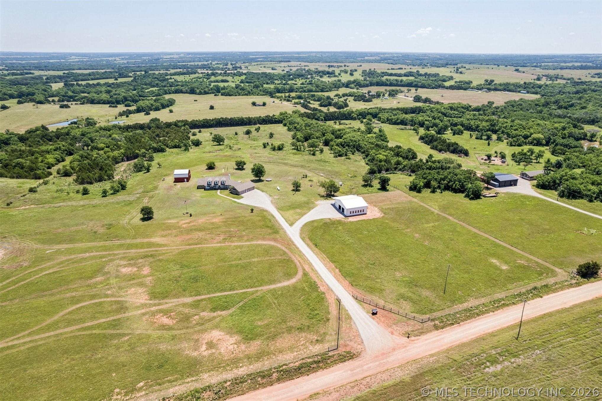Country Luxury at Its Finest! Nestled on 18 breathtaking acres with pa – image 2