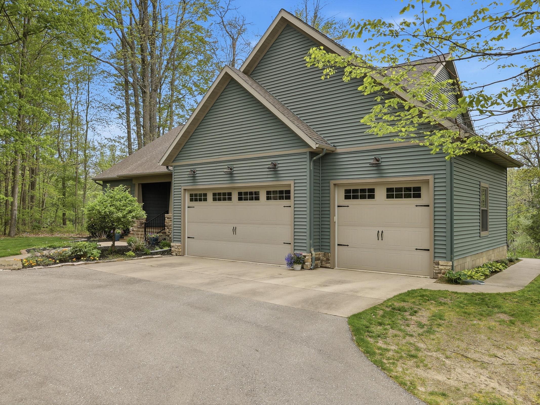 Tucked away on over an acre along the Little Muskegon River in the hea – image 5