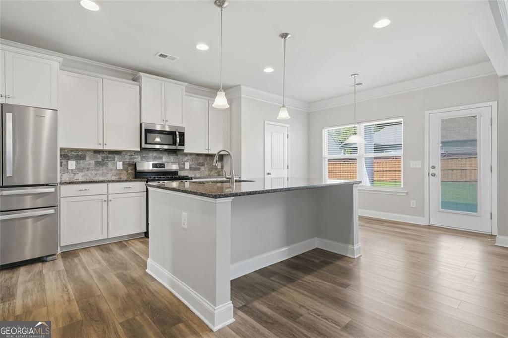 Flawlessly maintained and thoughtfully designed, this home exudes the – image 20