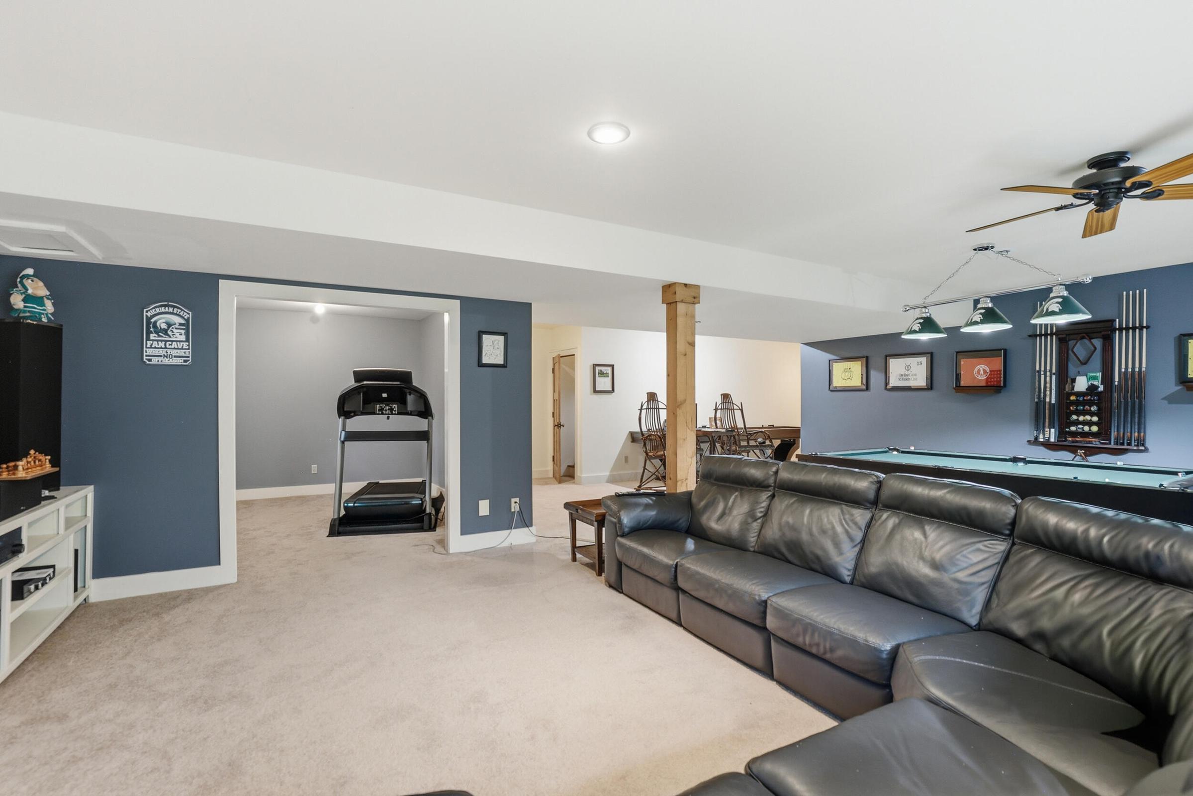 Tucked away on over an acre along the Little Muskegon River in the hea – image 37